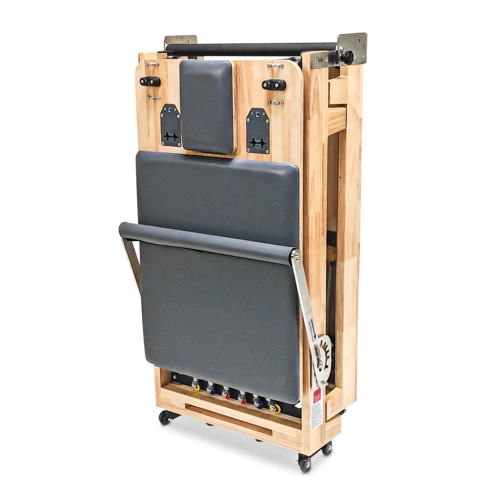 Front standing view of Impact Fitness Foldable Pilates Reformer in Dark Grey