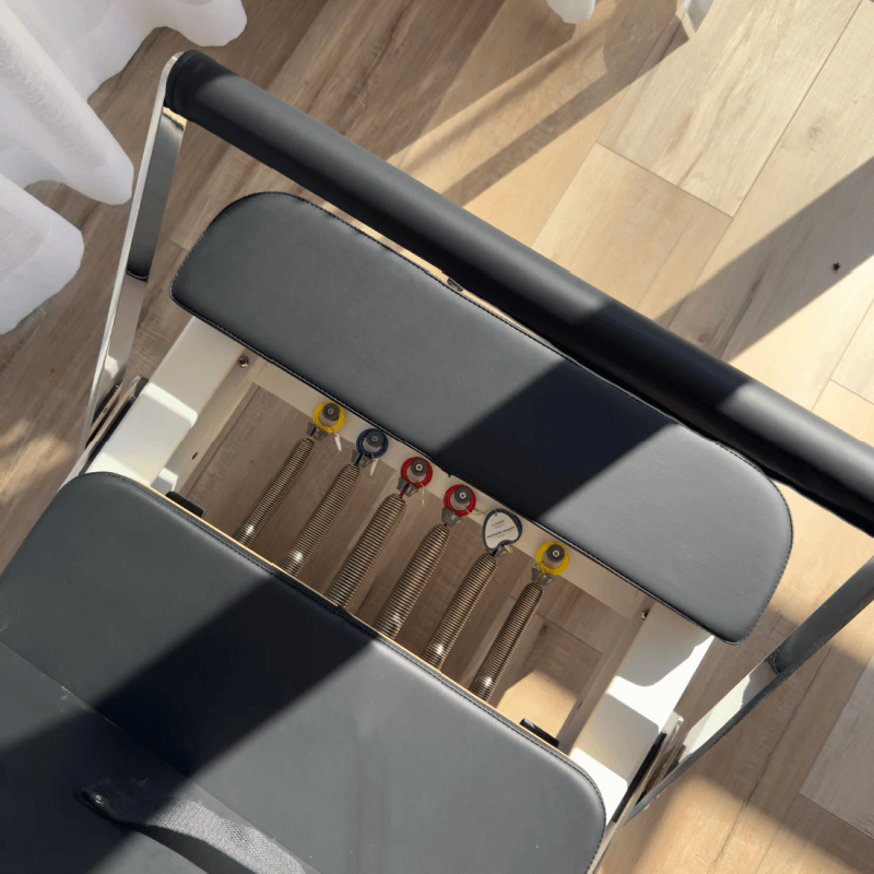Close up aerial view of pilates reformer machine springs
