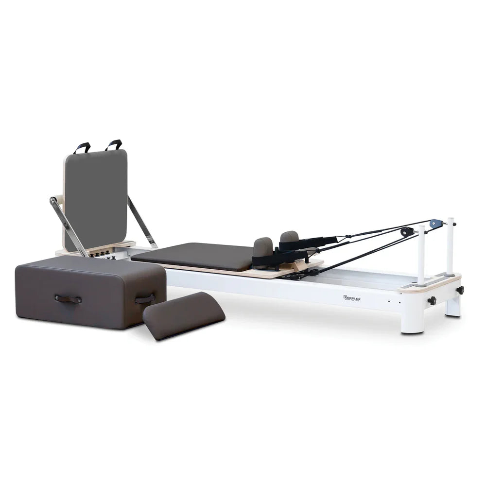 Angle Front View of Reeplex Flow Series Studio Reformer with Jump board in Dark Grey with White Aluminium Frame