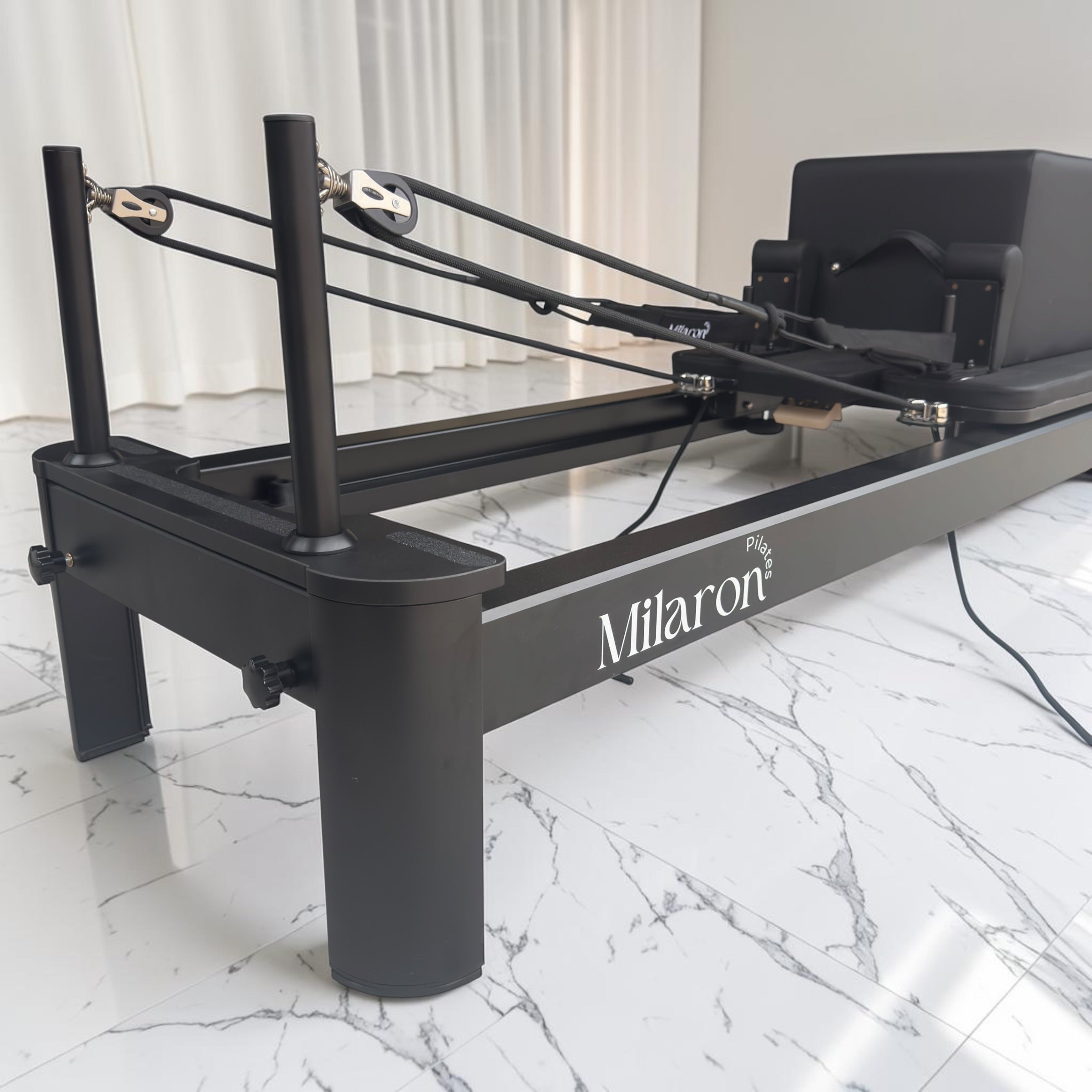 Milaron Pearl V3 reformer carriage with contoured shoulder pads and full-coverage microfibre leather upholstery