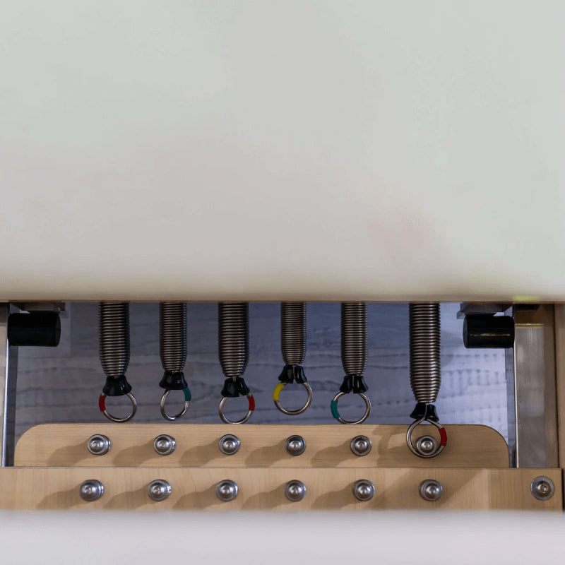 Aerial view close up of springs for Eco Foldable reformer in beige