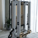 Close up image of the white frame queen foldable reformer in upright folded position