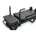Close Up Aerial View of Black Core Collab Sculptformer Pilates Reformer on White Background