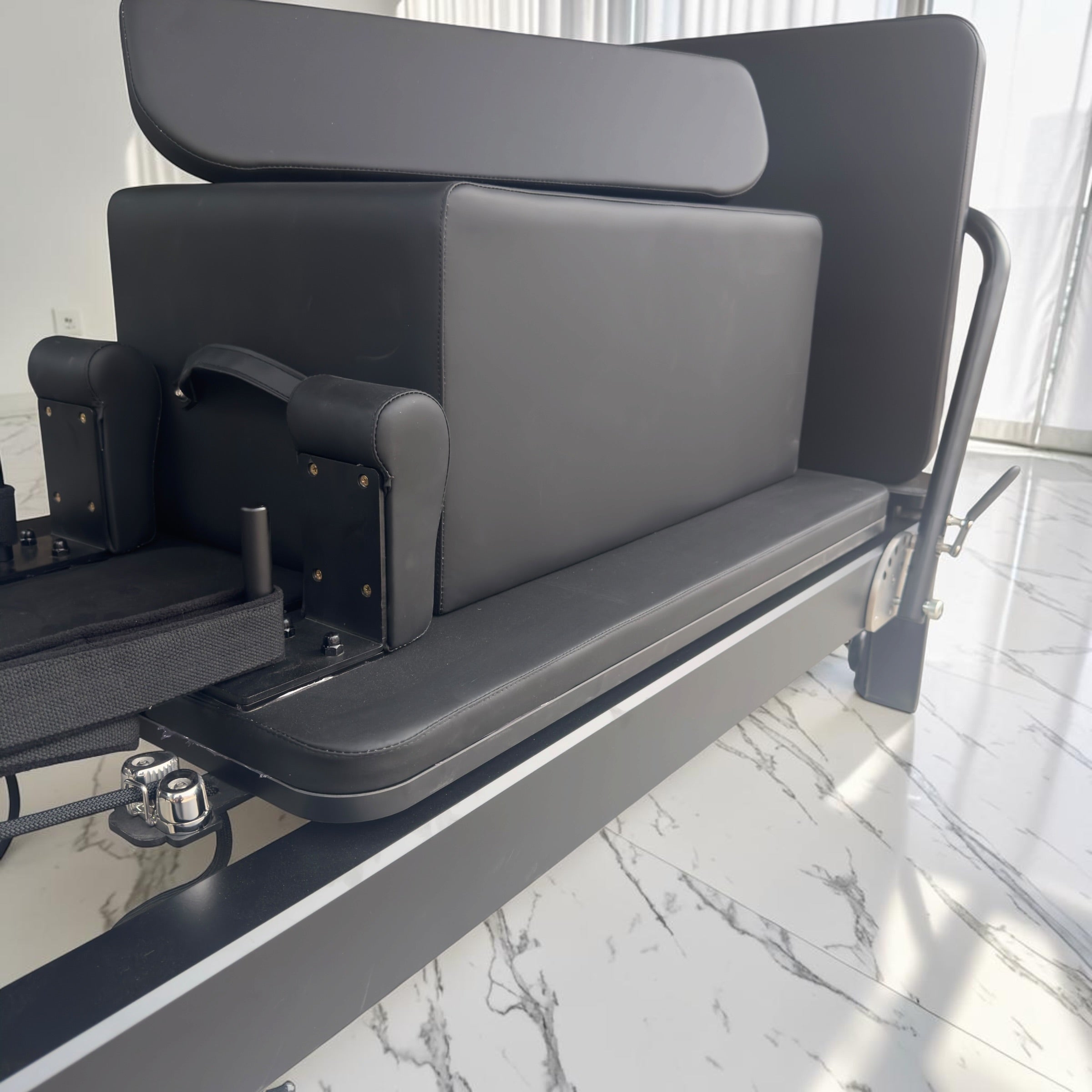 Milaron Pearl V3 reformer shown with the included Essentials Kit: Pilates box, jumpboard and accessories on the carriage