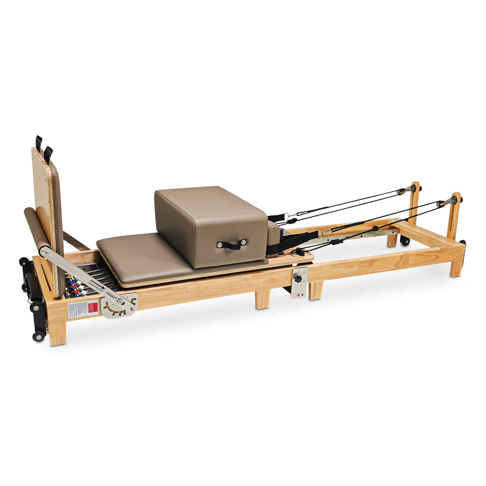 Angled Full Side View of Impact Fitness foldable reformer with jumpboard, sitting box and footbar in mocha