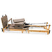 Full Side View of Impact Fitness foldable reformer with jumpboard, sitting box and footbar in mocha