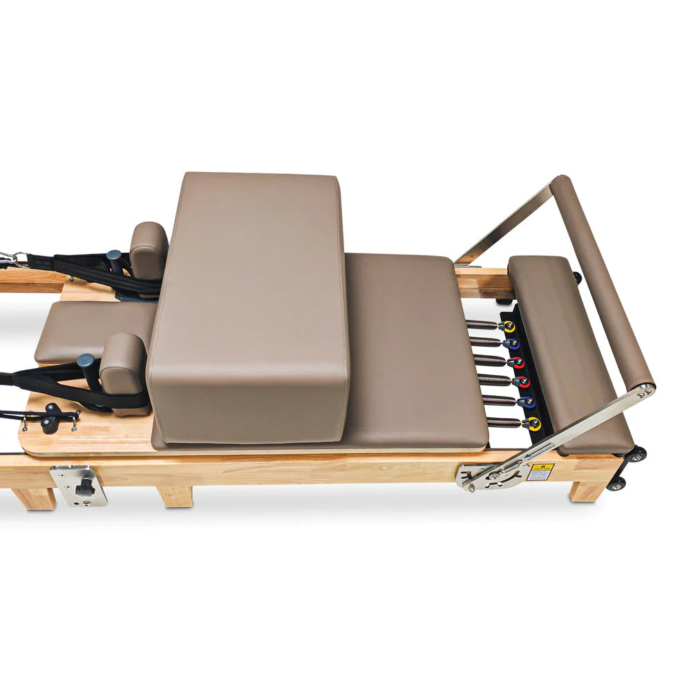 Carriage and footbar close up of Impact Fitness Foldable Reformer in Mocha with sitting box
