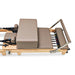 Carriage and footbar close up of Impact Fitness Foldable Reformer in Mocha with sitting box
