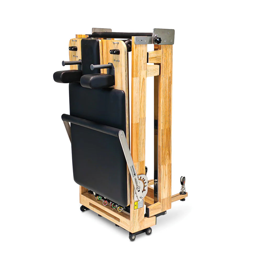 Front folded standing view of Impact Fitness Foldable Pilates Reformer in black