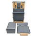 Folded upright front view of Impact Fitness foldable reformer in Dark Grey with sitting box, foot pad and jumpboard