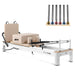 Full view of white pilates reformer on white background with inlay image of pilates reformer springs