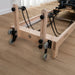 Close up view of wooden pulley riser on reformer machine on wooden floors