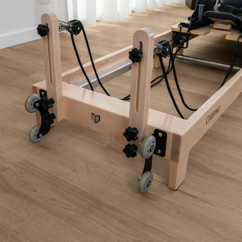 Close up view of wooden pulley riser on reformer machine on wooden floors