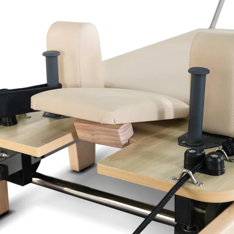 Close up of raised beige headrest on Lifespan Fitness Wooden Pilates Reformer