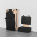 Folded Lifespan Fitness Contour Pilates reformer machine with attachments on a gray floor against a white wall