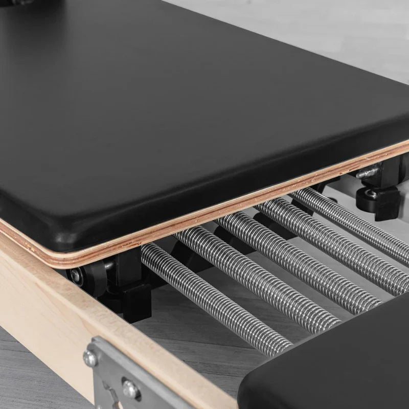 Close up aerial view of pilates reformer springs
