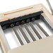 Close-up of a wooden frame with metal springs and adjustable components.