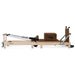 Side View Brown Wooden Pilates Reformer machine on white background