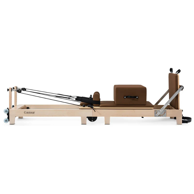 Side View Brown Wooden Pilates Reformer machine on white background