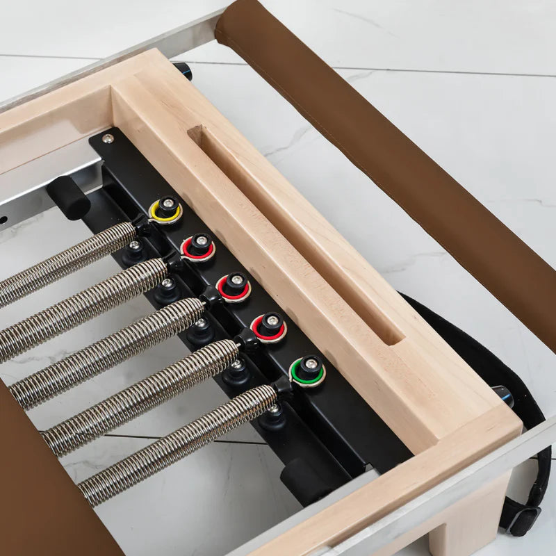 Aerial view springs on wooden Pilates Reformer