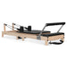 Full Side View on Angle black wooden pilates reformer on white background