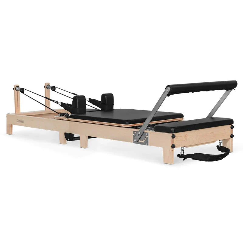 Full Side View on Angle black wooden pilates reformer on white background