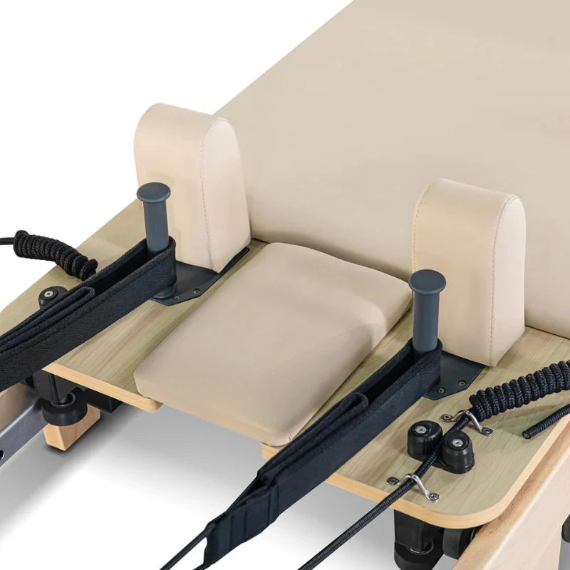 Aerial view of beige headrest and shoulder pads for Lifespan Fitness Contour Wooden Pilates Reformer
