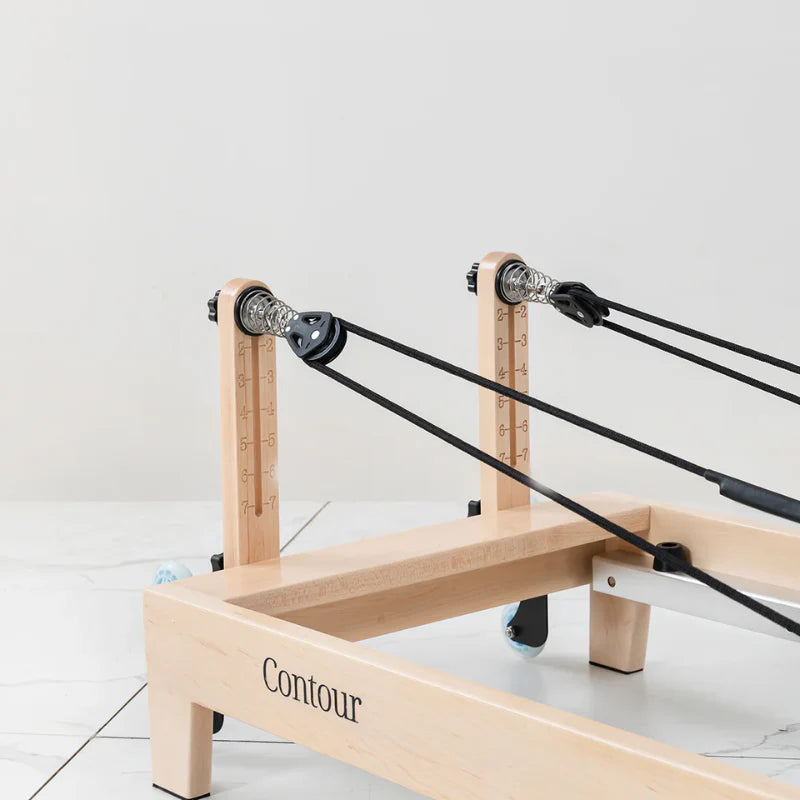 Close up wooden pulley riser for pilates reformer