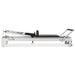 Full Side View of White aluminium Pilates reformer on a white background