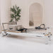 Pilates reformer machine with 'ContourPro' branding in a studio setting