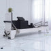 Milaron Blanc Pilates reformer machine in a white room with marble floor with accessories on top of carriage