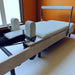 Close up of creme carriage on Milaron Maple Foldable reformer showing carriage, raised footbar and shoulder rests