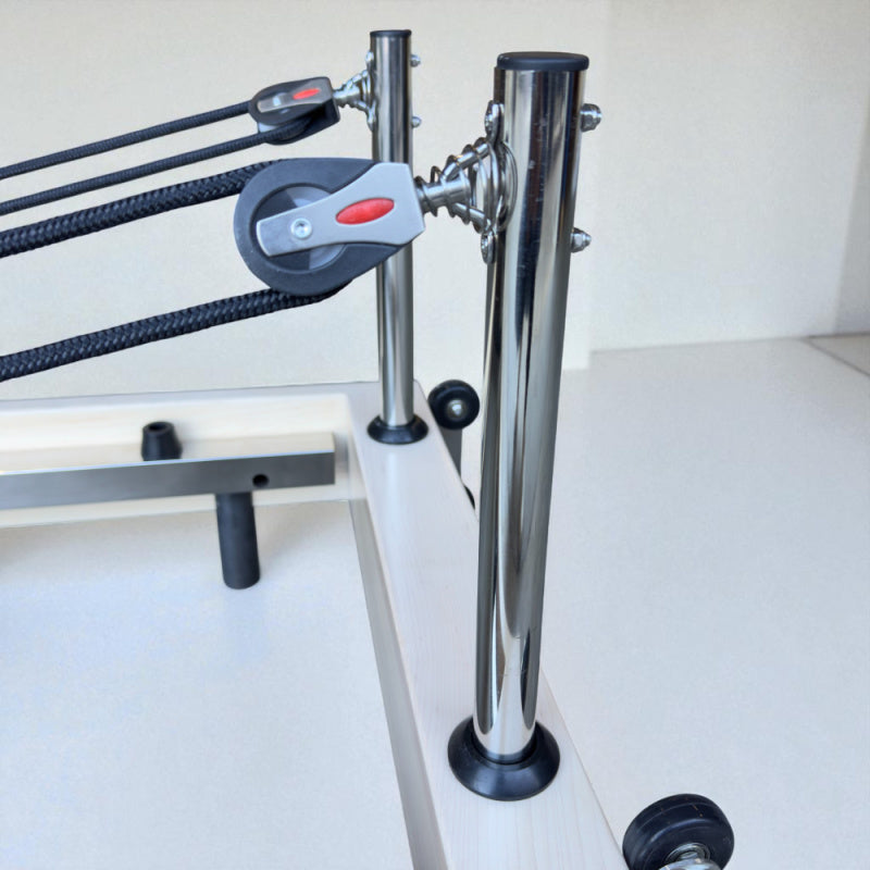 Close up of metal poles on the Milaron Maple Foldable reformer for ropes to hook between