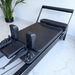 Close up angle view of carriage and footbar on Milaron Pearl Reformer Machine