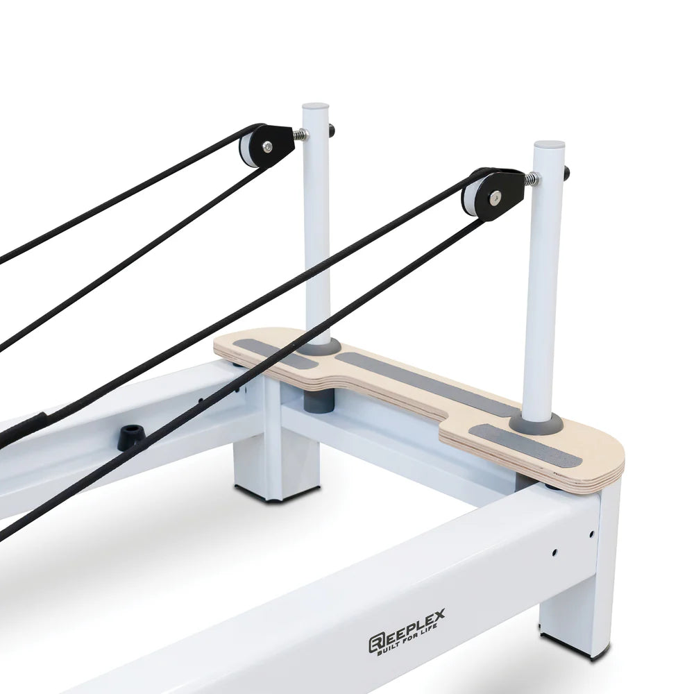 Pulley Riser Close Up of Reeplex Flow Series Studio Reformer with White Aluminium Frame