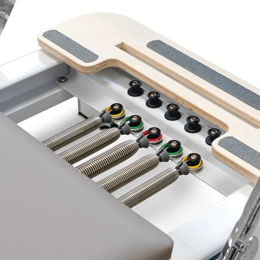 Close Up of Springs for Reeplex Flow Series Studio Reformer with Jump board in Brown with White Aluminium Frame