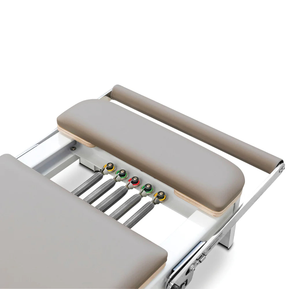 Close Up of Standing Platform of Reeplex Flow Series Studio Reformer in Brown with White Aluminium Frame