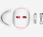 Flatlay of the Theraface LED Mask with goggles and cord and base attachments